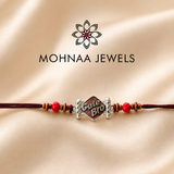 Cute Bro designer rakhi with decorative red beads and premium thread for Raksha Bandhan