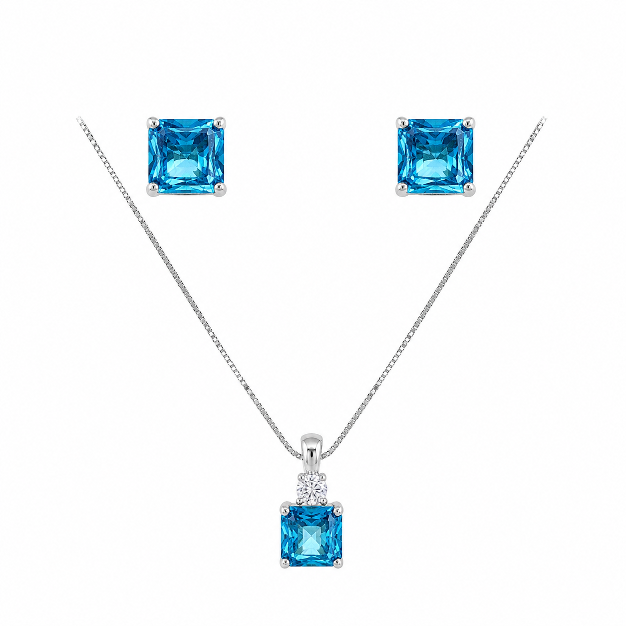 Ira Ocean Spark 925 sterling silver pendant, earrings and chain set featuring princess-cut blue cubic zirconia stones.