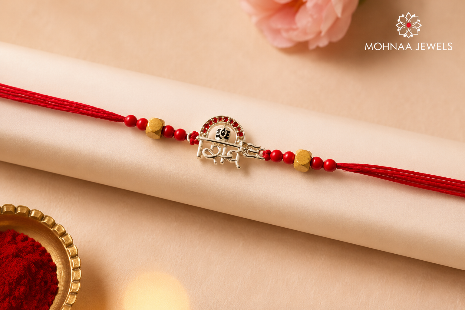 Shiv Shakti Silver Rakhi with sacred Shiv-inspired motif and red thread by Mohnaa Jewels