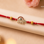 Shiv Shakti Silver Rakhi with sacred Shiv-inspired motif and red thread by Mohnaa Jewels