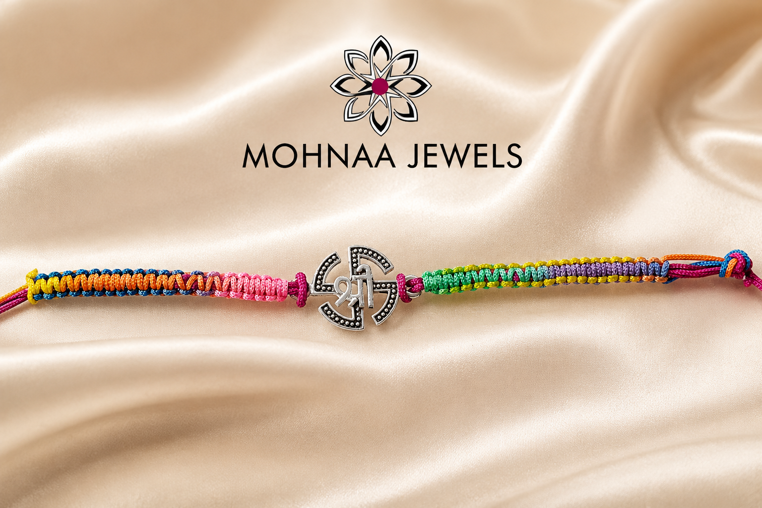 "Auspicious Shree Silver Rakhi featuring a sacred Shree symbol in sterling silver with vibrant handcrafted multicolor threadwork, designed for Raksha Bandhan and presented by Mohnaa Jewels."