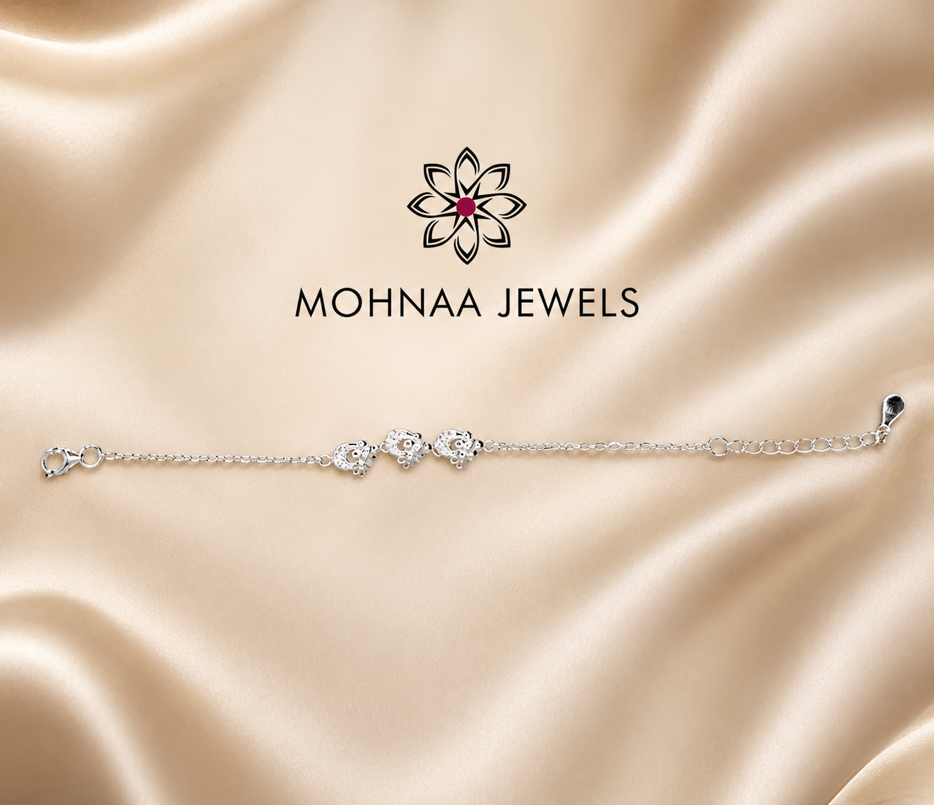 "Premium 925 sterling silver Good Luck Rakhi with butterfly charms and adjustable chain, handcrafted for Raksha Bandhan by Mohnaa Jewels."