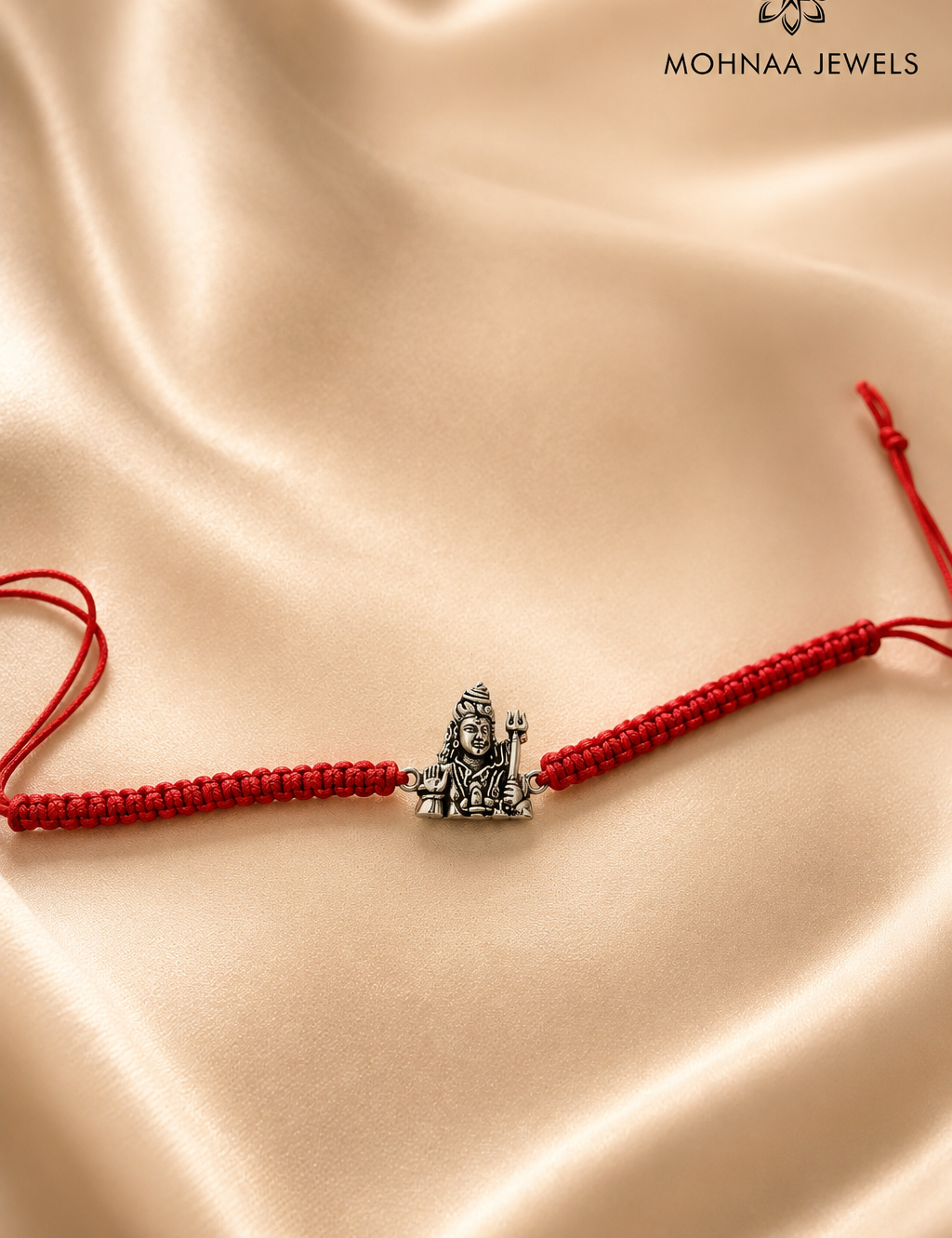 Rudra Mahadev 925 Sterling Silver Rakhi featuring detailed Lord Shiva motif on handcrafted red thread by Mohnaa Jewels