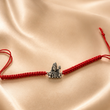 Rudra Mahadev 925 Sterling Silver Rakhi featuring detailed Lord Shiva motif on handcrafted red thread by Mohnaa Jewels